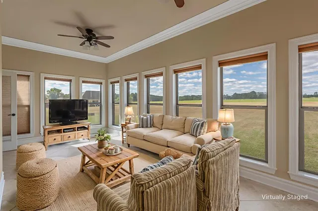 a living room with furniture and a flat screen tv