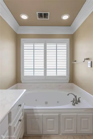 a bathroom with a bathtub and a sink
