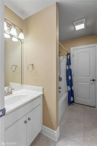 a bathroom with a sink and mirror