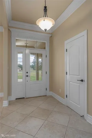 a view of an empty room with glass door