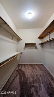 a kitchen with a sink cabinets and wooden floor
