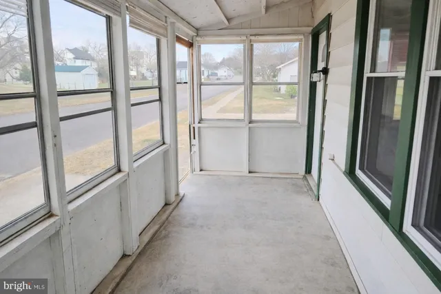 a view of an empty room and window