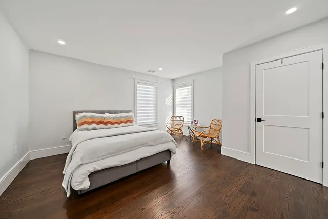 a bedroom with a bed and a couch