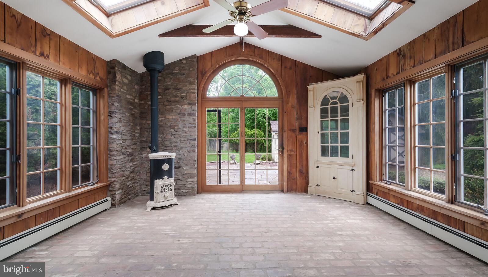 805 Township Line Road Newtown, PA 18940 - Photo 11 of 40 Sunroom or Office with woodstove