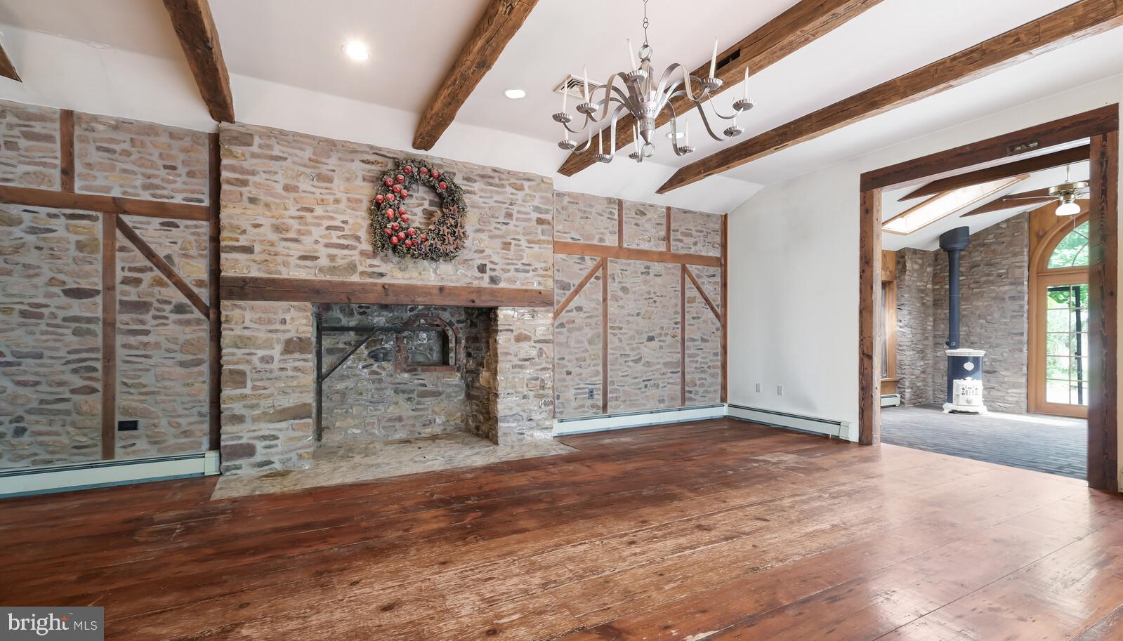 805 Township Line Road Newtown, PA 18940 - Photo 4 of 40 Family Room with full stone wall