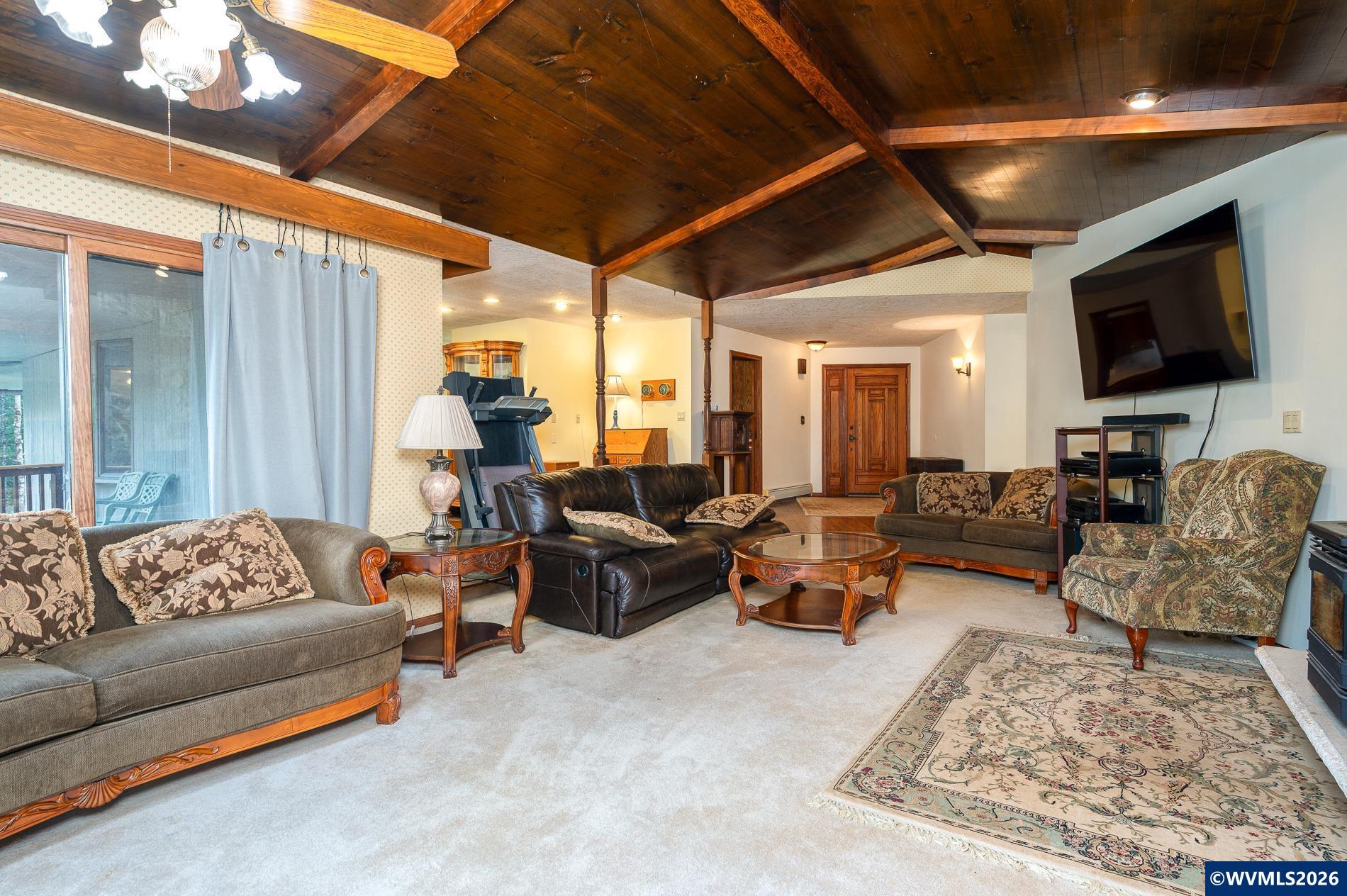 27572 South Kinzy Road Estacada, OR 97023 - Photo 10 of 50 a living room with furniture and a flat screen tv