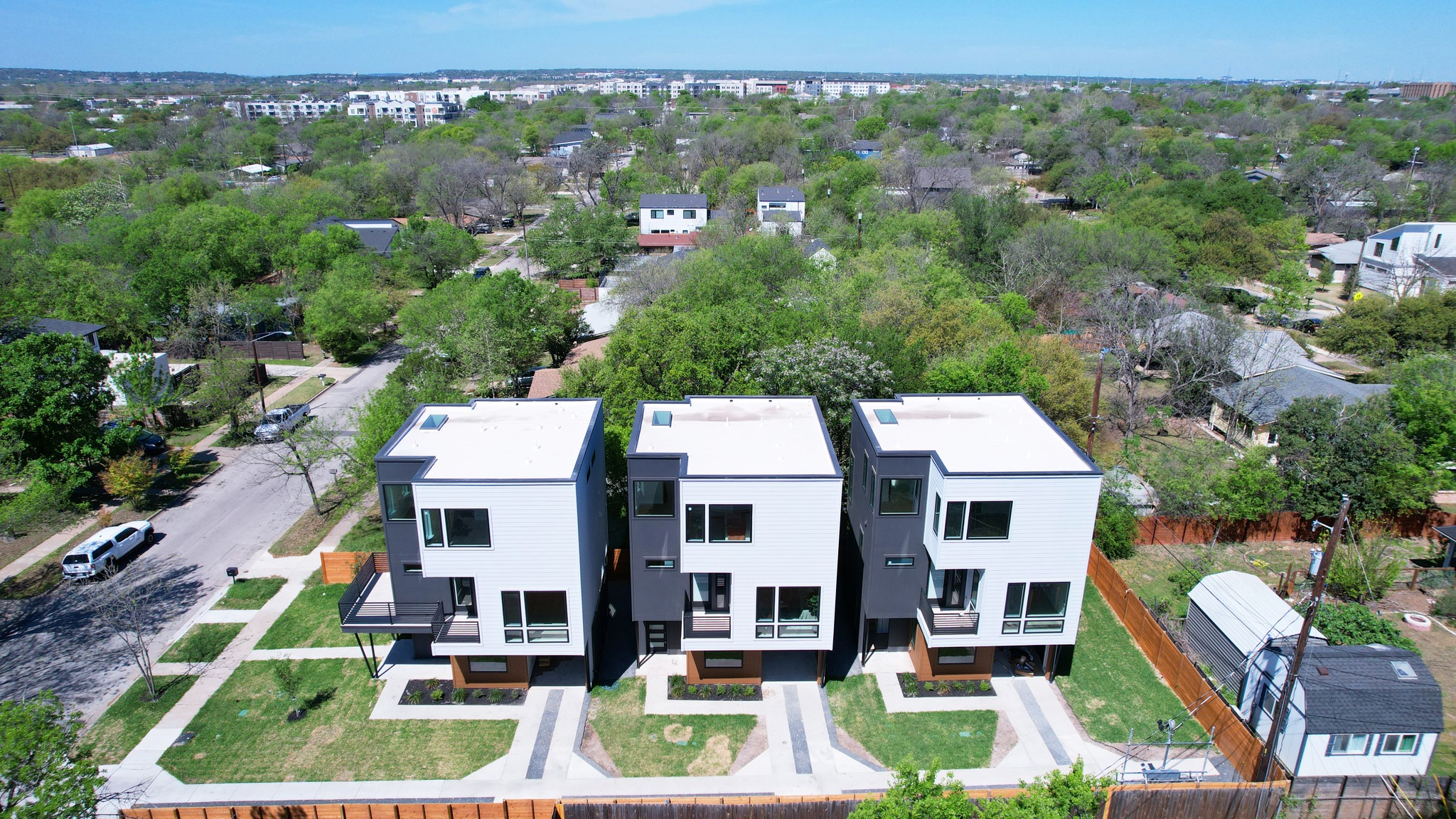 100 West Odell Street, Unit 1 Austin, TX 78752 - Photo 2 of 39 an aerial view of a residential apartment building with a yard and lake view