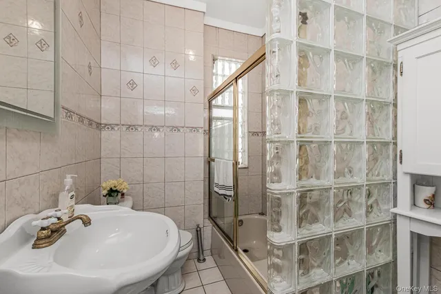 a bathroom with a sink and shower