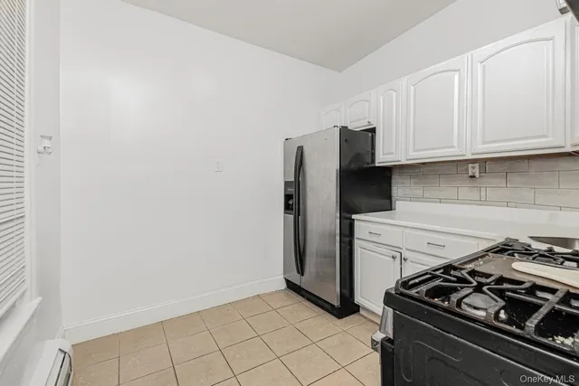 a kitchen with a stove and a refrigerator
