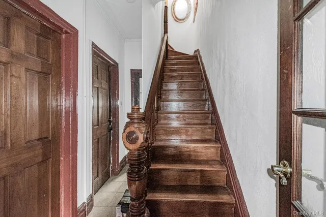 a view of staircase with wooden floor and windows