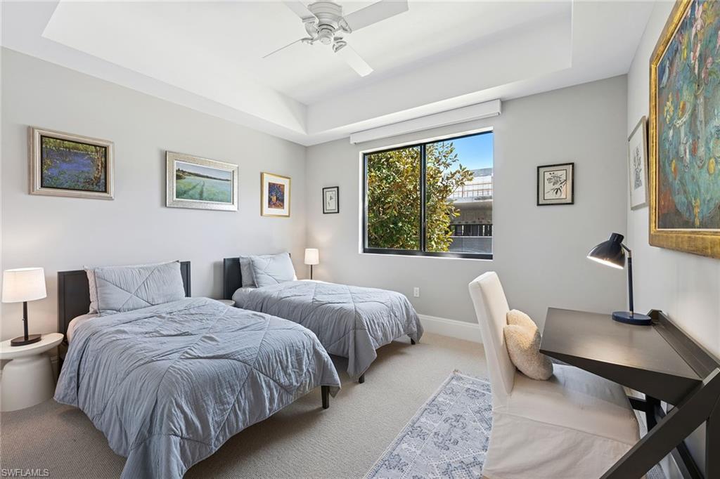 1135 3rd Avenue South, Unit 119 Naples, FL 34102 - Photo 25 of 50 a bedroom with two beds and a window