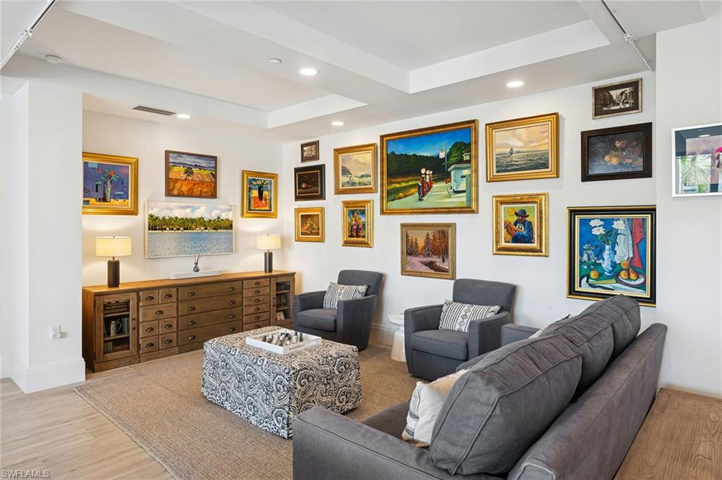 1135 3rd Avenue South, Unit 119 Naples, FL 34102 - Photo 31 of 50 a living room with furniture window and a fireplace