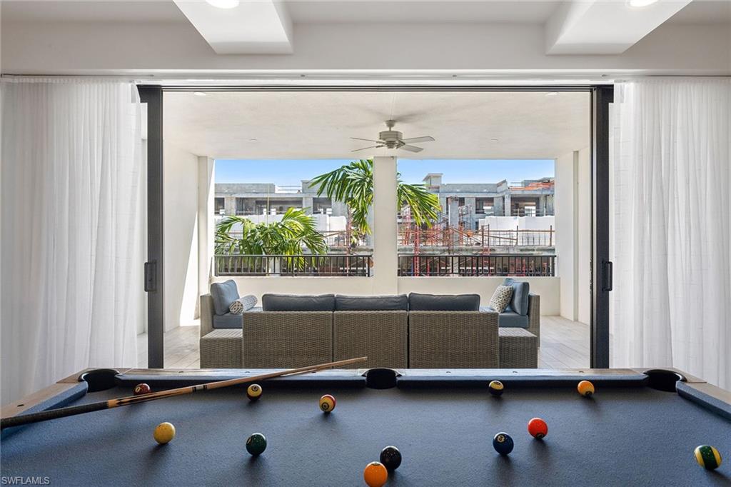 1135 3rd Avenue South, Unit 119 Naples, FL 34102 - Photo 36 of 50 a living room with furniture window and table