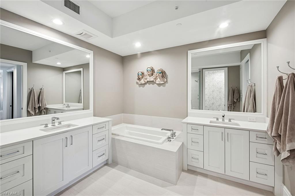 1135 3rd Avenue South, Unit 119 Naples, FL 34102 - Photo 43 of 50 a bathroom with a double vanity sink mirror and