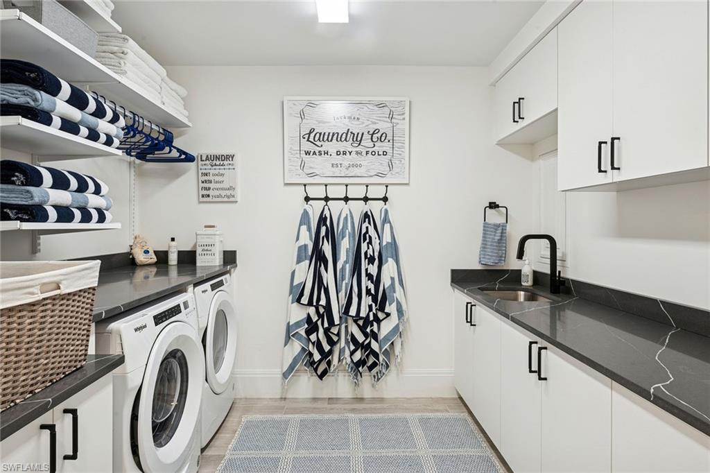 1135 3rd Avenue South, Unit 119 Naples, FL 34102 - Photo 44 of 50 a view of a kitchen with sink washer and dryer