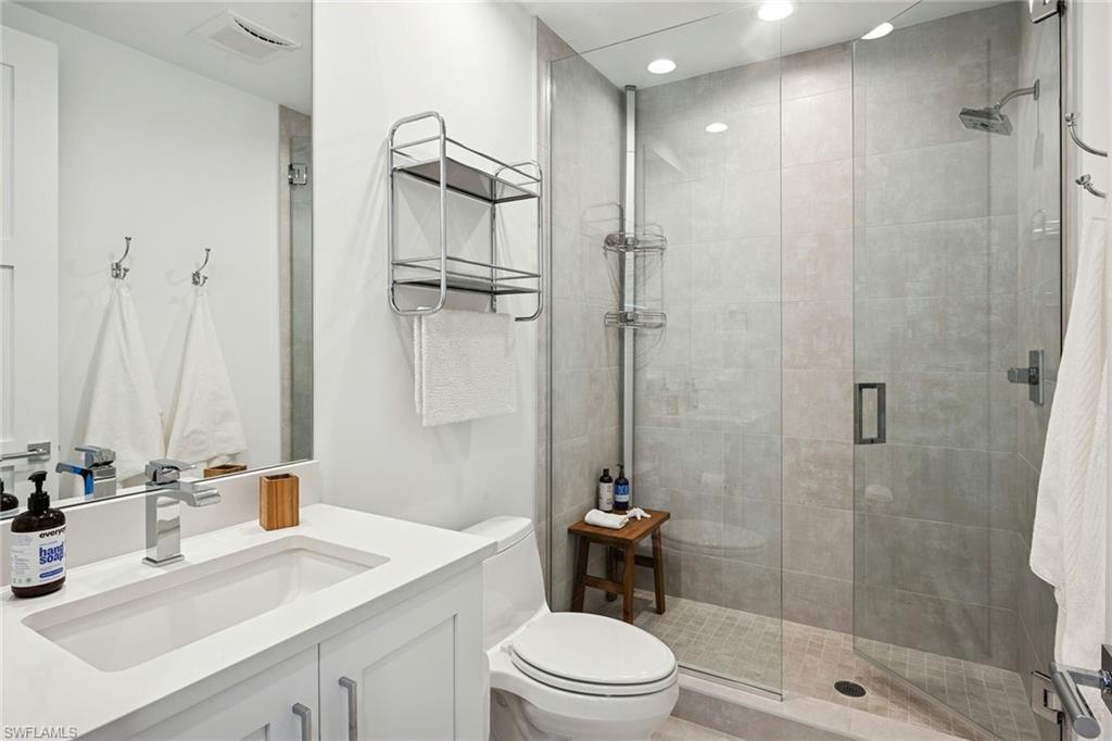 1135 3rd Avenue South, Unit 119 Naples, FL 34102 - Photo 47 of 50 a bathroom with a sink a toilet and shower