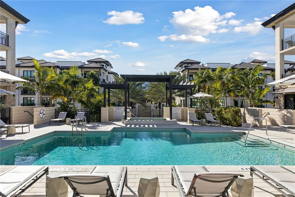 1135 3rd Avenue South, Unit 119 Naples, FL 34102 - Photo 48 of 50 a view of a chairs and table in backyard yard