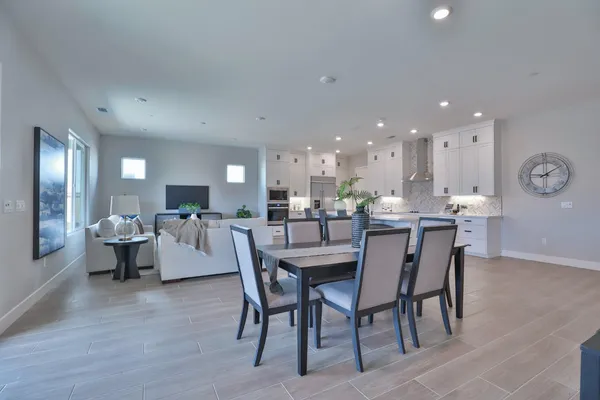 a living room with lots of furniture and white walls