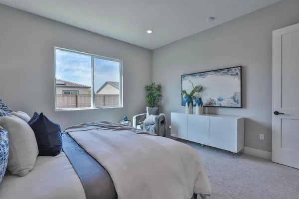 a view of a livingroom with an empty space and a hallway