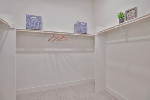 a view of bathroom with a sink and mirror