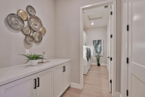 a spacious bedroom with a bed and a table