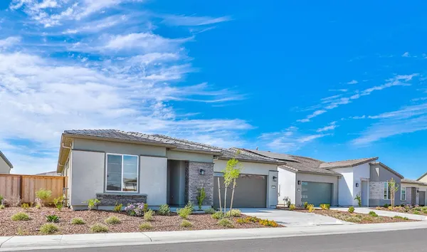 a large kitchen with a table and chairs