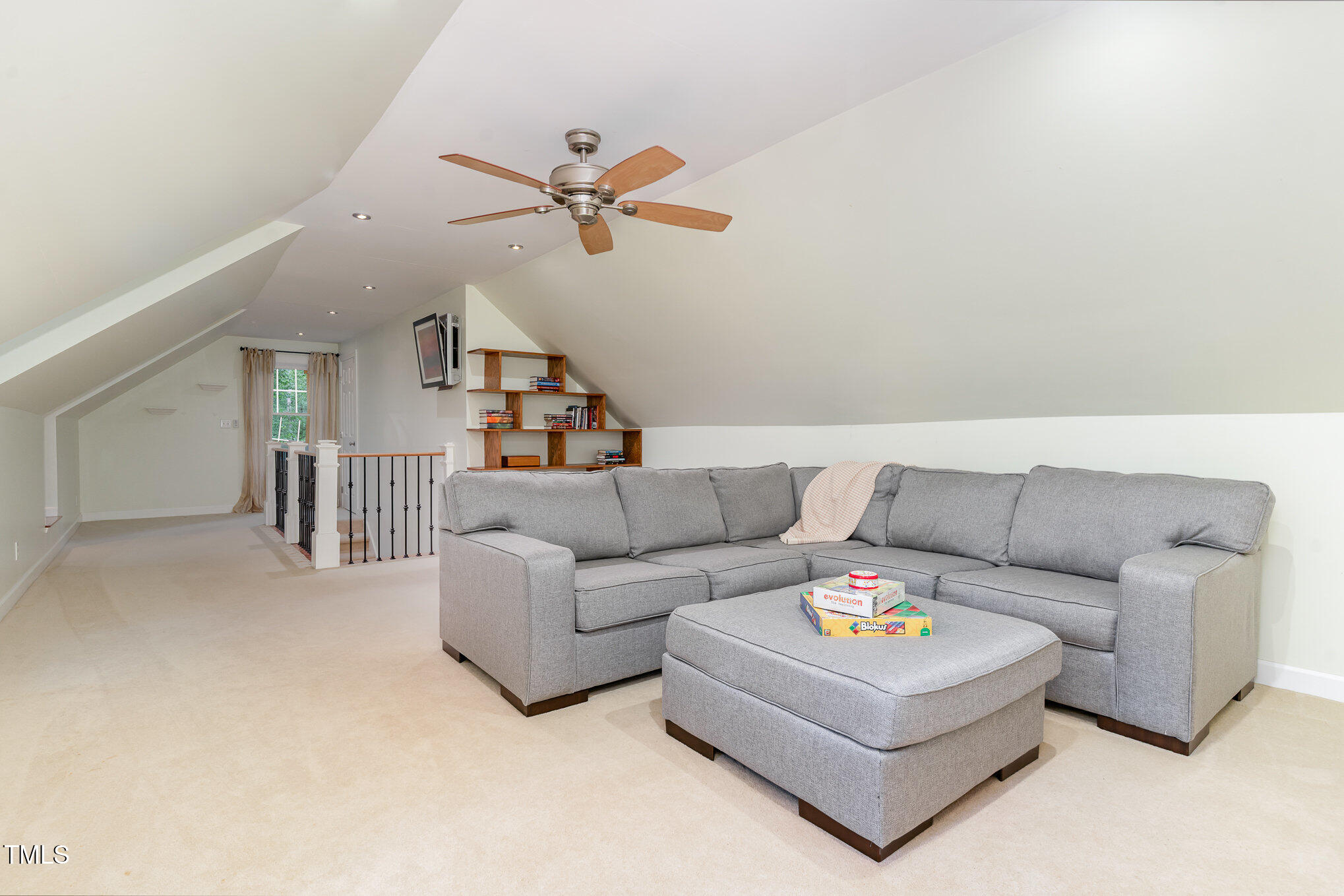 12709 Timberlane Court Raleigh, NC 27613 - Photo 27 of 44 Finished attic with newer carpet, newer sofa (conveys), mini-split HVAC, ready for game night, karaoke and a retreat for kids and parents alone times. (Non-permitted)