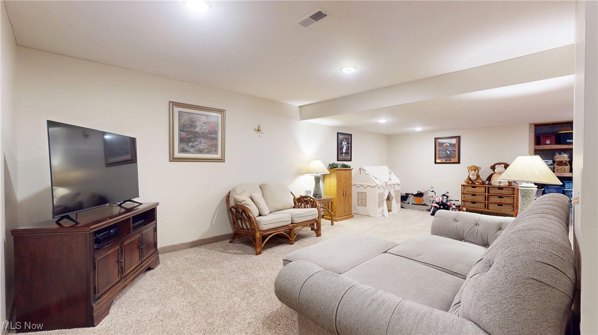 961 Industry Road Atwater, OH 44201 - Photo 27 of 50 Living area with light carpet and recessed lighting