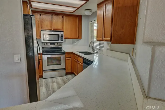 a kitchen with a refrigerator stove and microwave