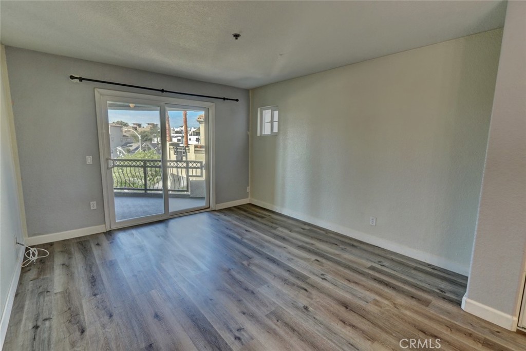 310 Lake Street Huntington Beach, CA 92648 - Photo 16 of 38 wooden floor in an empty room with a window