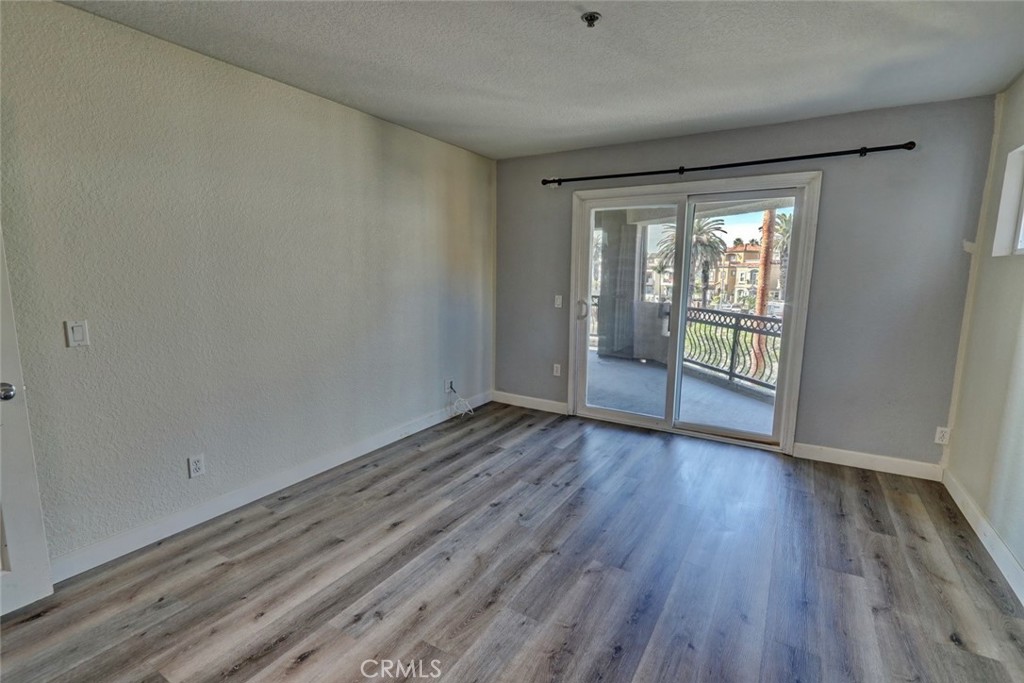 310 Lake Street Huntington Beach, CA 92648 - Photo 17 of 38 wooden floor in an empty room with a window