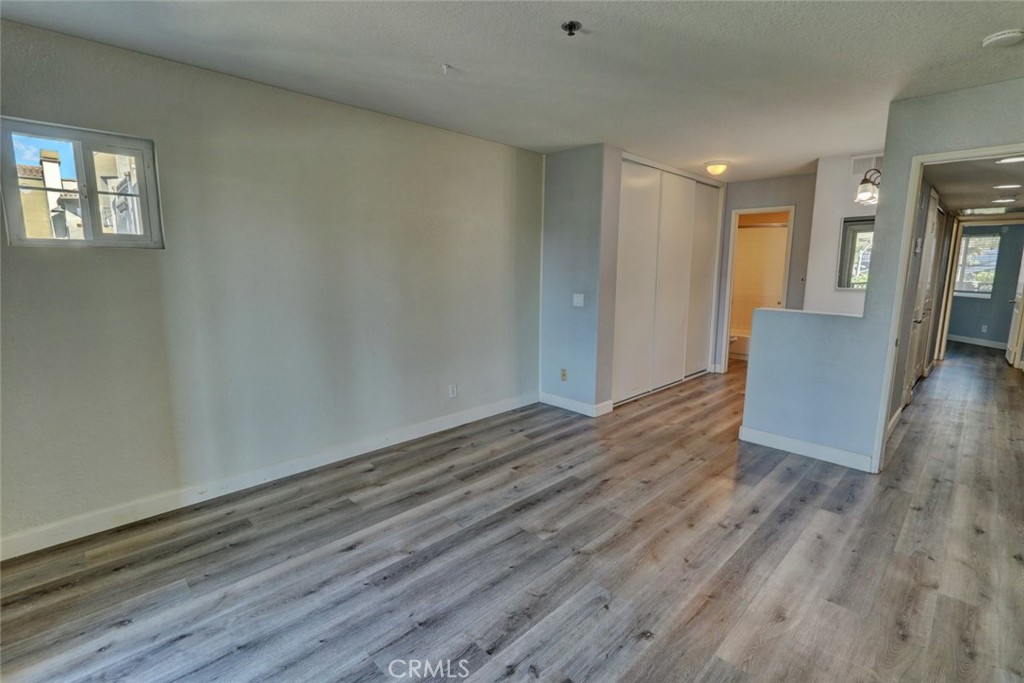 310 Lake Street Huntington Beach, CA 92648 - Photo 18 of 38 wooden floor in an empty room with a window