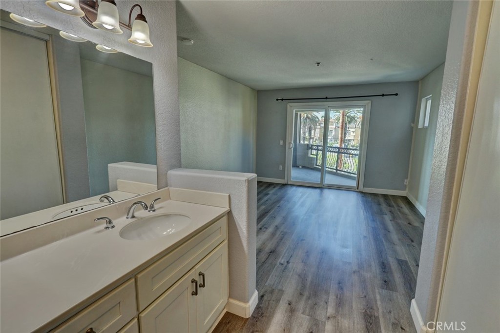 310 Lake Street Huntington Beach, CA 92648 - Photo 21 of 38 a room with a sink window and wooden floor