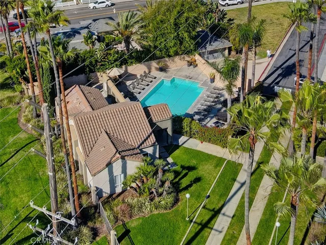 a front view of a house with a yard table and chairs