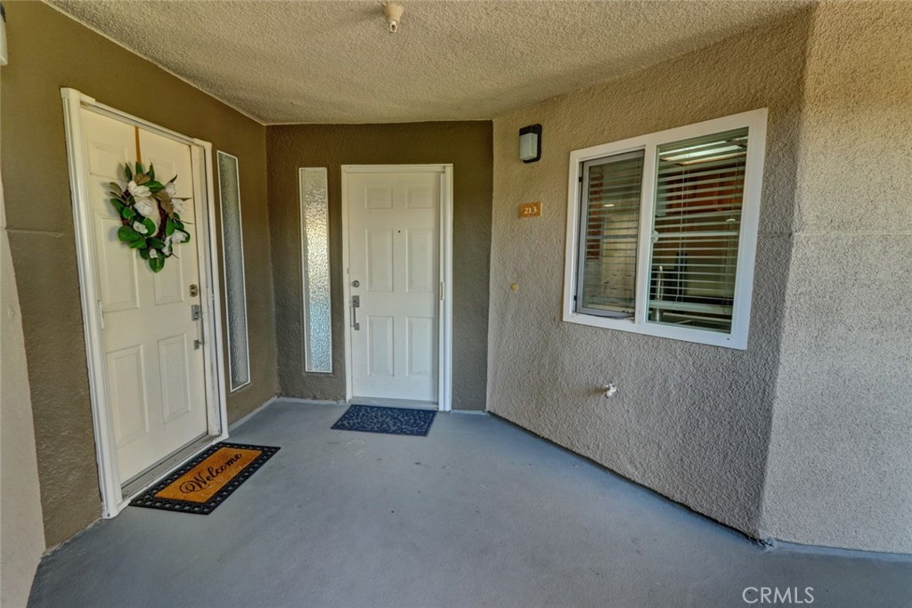 310 Lake Street Huntington Beach, CA 92648 - Photo 3 of 38 a view of a room with an entryway and wooden floor