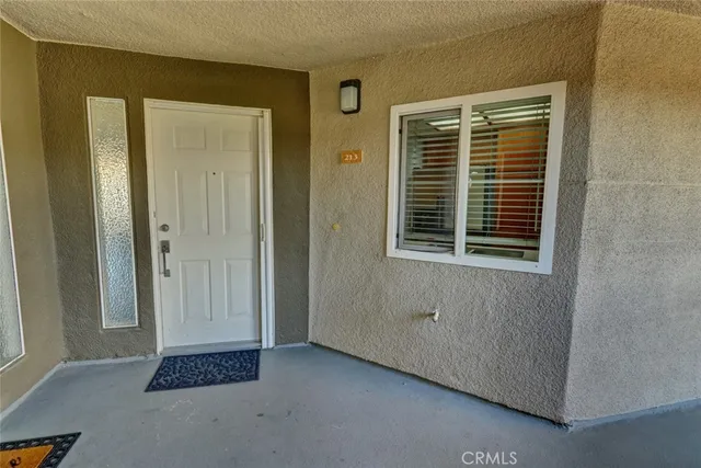 a view of a room with wooden floor and fireplace