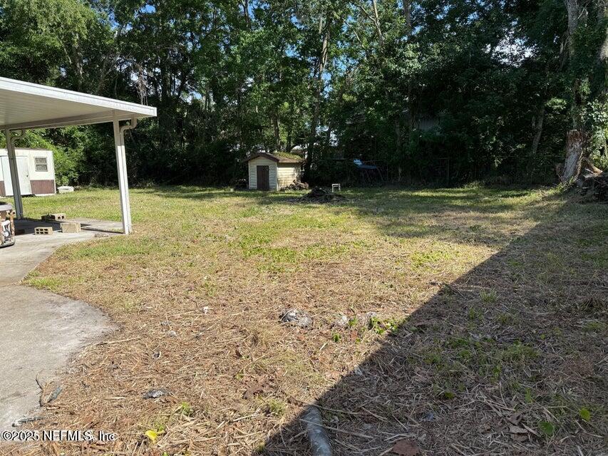 9324 Joos Road Jacksonville, FL 32220 - Photo 12 of 14 a view of a backyard with a garden
