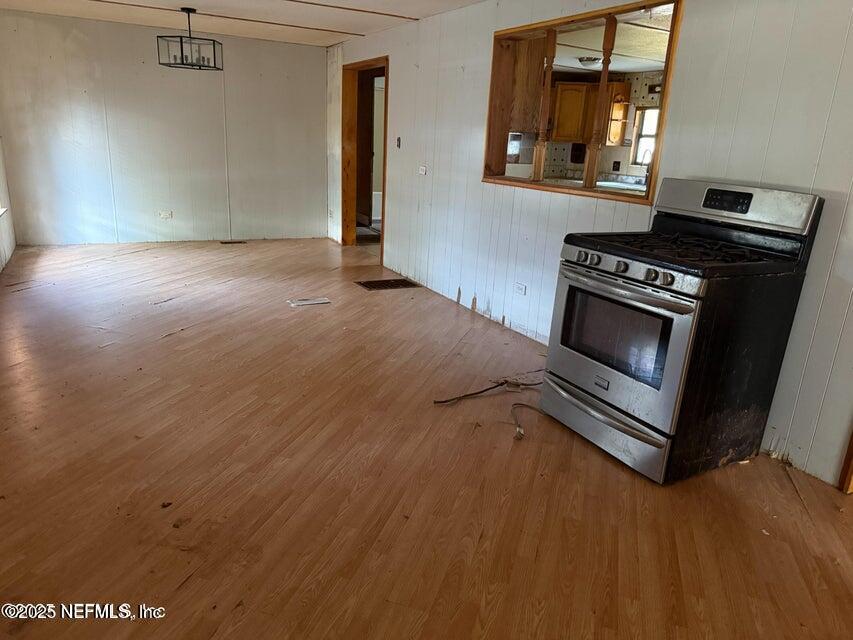9324 Joos Road Jacksonville, FL 32220 - Photo 2 of 14 a kitchen with a stove and a microwave