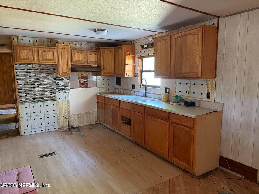 9324 Joos Road Jacksonville, FL 32220 - Photo 3 of 14 a kitchen with stainless steel appliances sink cabinets and window