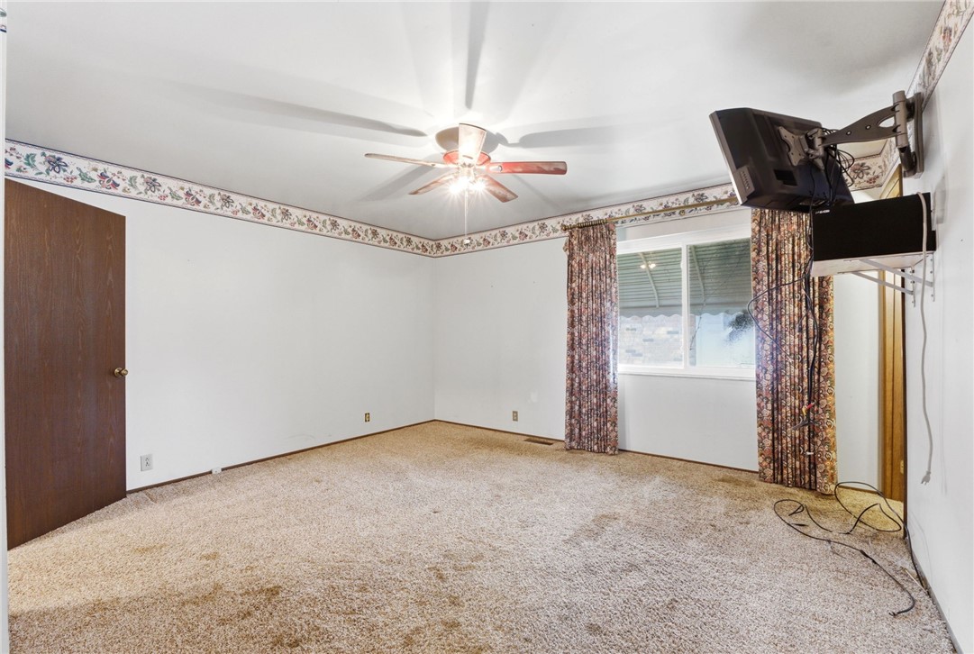 6711 Hamilton-Middletown Road Franklin, OH 45005 - Photo 25 of 49 This spacious bedroom offers ample natural light and a comfortable, carpeted floor.