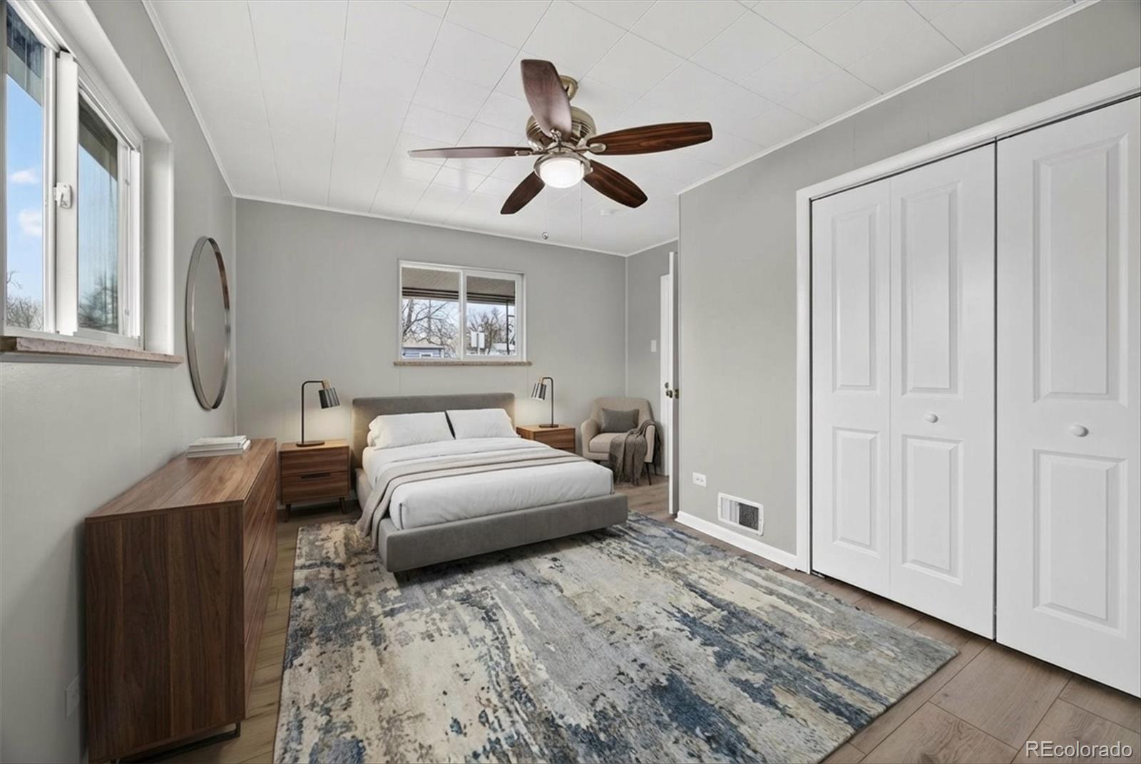 705 Perry Street Denver, CO 80204 - Photo 13 of 23 a bedroom with a bed and a ceiling fan