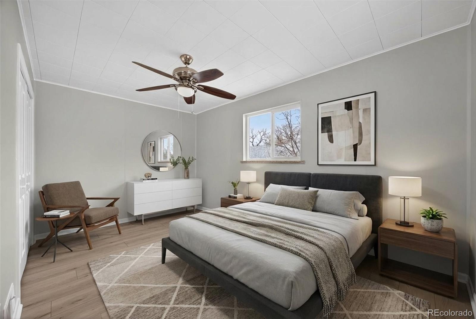 705 Perry Street Denver, CO 80204 - Photo 17 of 23 a bedroom with a bed and a chandelier