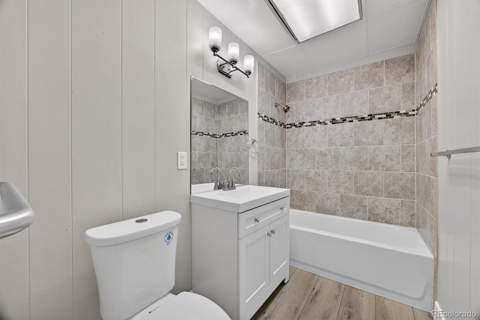 705 Perry Street Denver, CO 80204 - Photo 19 of 23 a bathroom with a sink a toilet and shower