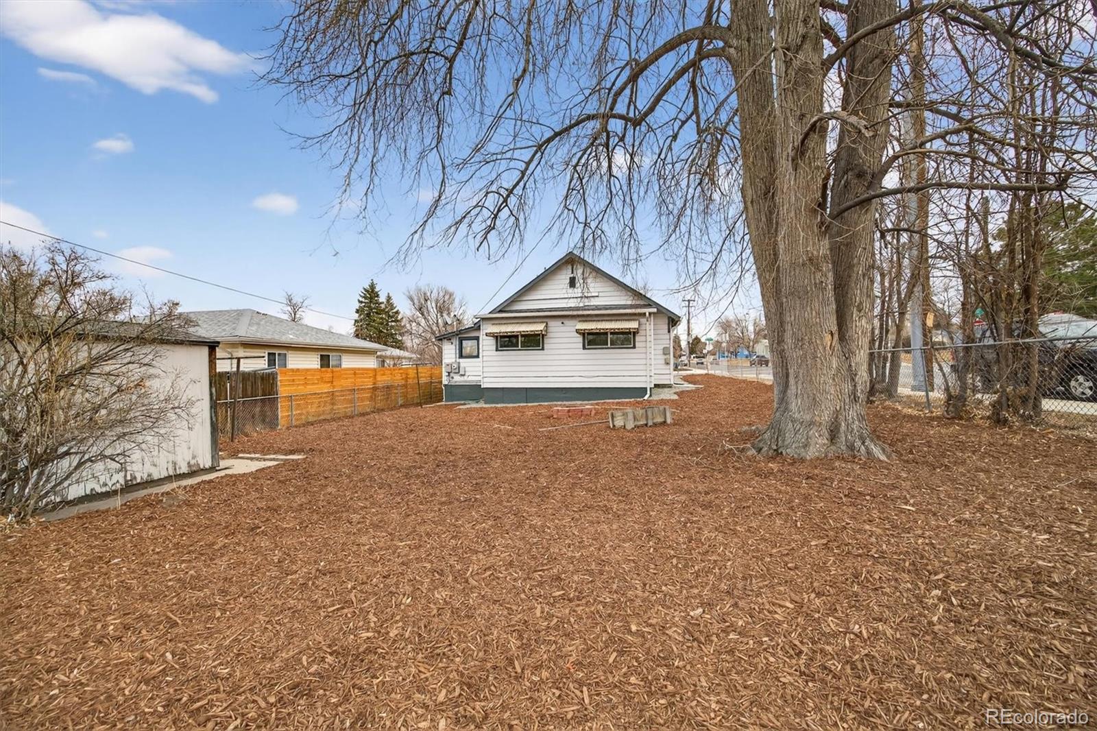 705 Perry Street Denver, CO 80204 - Photo 20 of 23 a view of garage yard and a patio