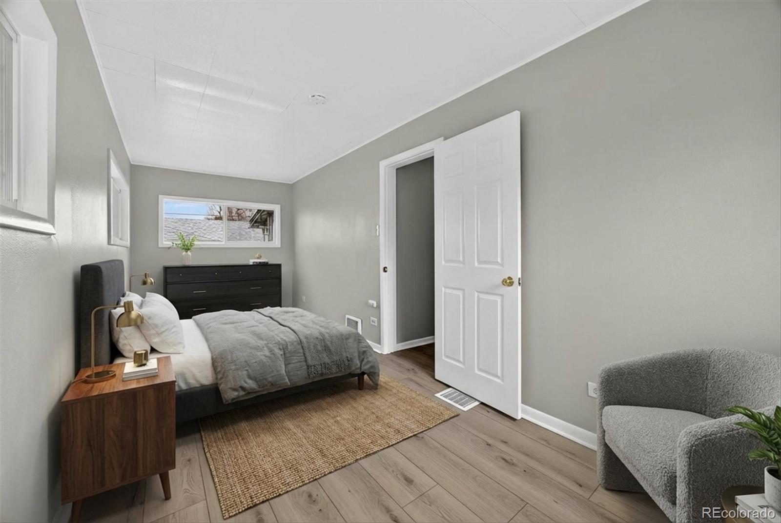 705 Perry Street Denver, CO 80204 - Photo 10 of 23 a bedroom with a bed and a couch