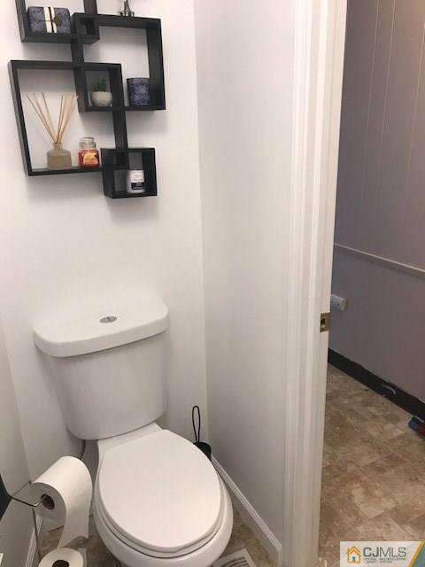 20 Burns Road, Unit 20 North Brunswick, NJ 08902 - Photo 14 of 18 a white toilet sitting next to a bathroom sink