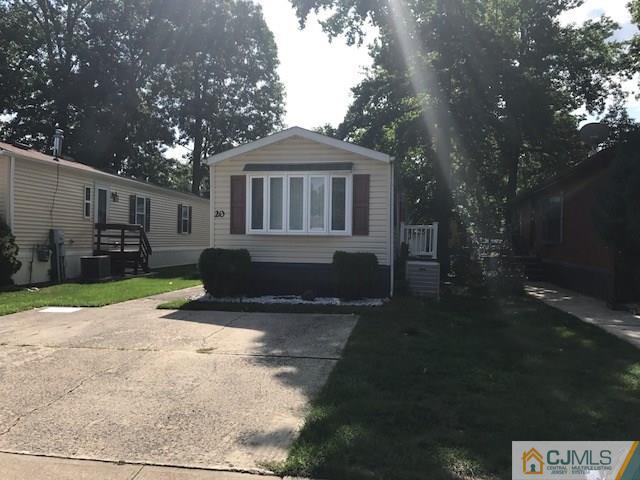 20 Burns Road, Unit 20 North Brunswick, NJ 08902 - Photo 17 of 18 a front view of a house with a yard and garage