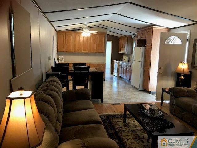 20 Burns Road, Unit 20 North Brunswick, NJ 08902 - Photo 3 of 18 a living room with furniture and a large window