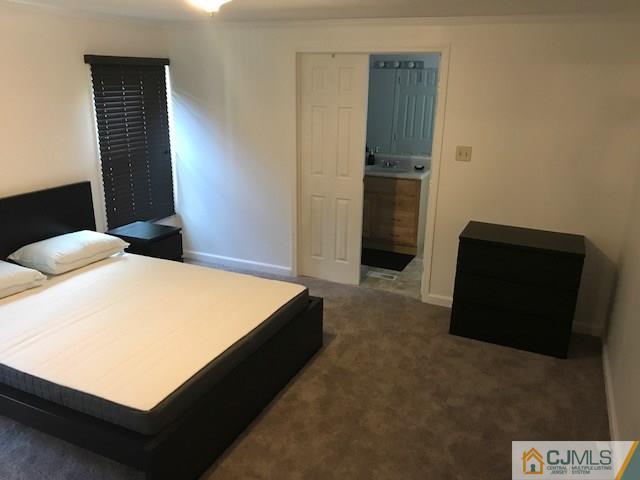 20 Burns Road, Unit 20 North Brunswick, NJ 08902 - Photo 6 of 18 a room with a bed and a television