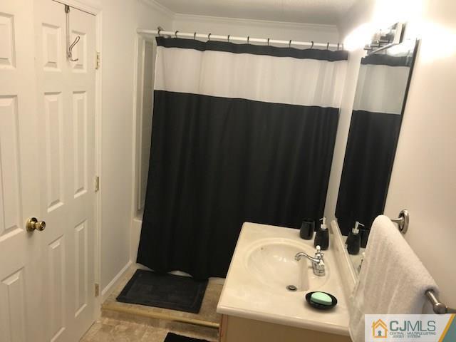20 Burns Road, Unit 20 North Brunswick, NJ 08902 - Photo 10 of 18 a bathroom with a sink and a mirror